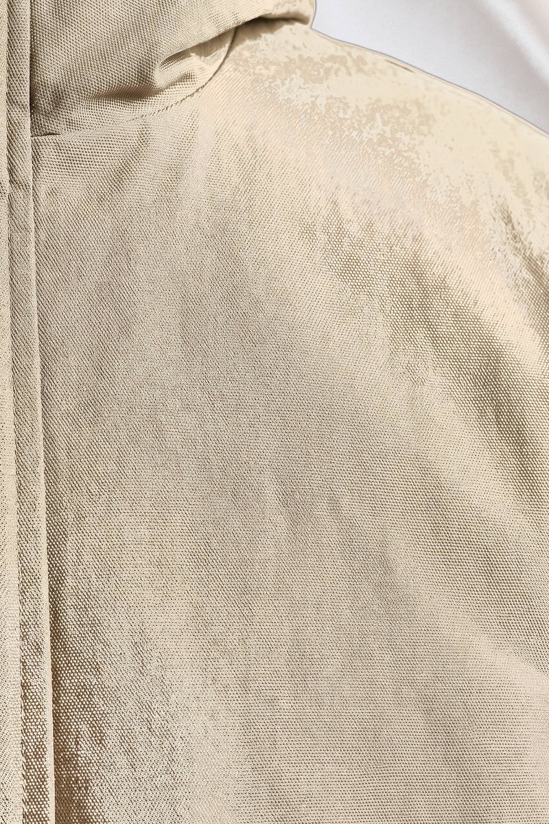 Gustav parka i sand — tygdetalj