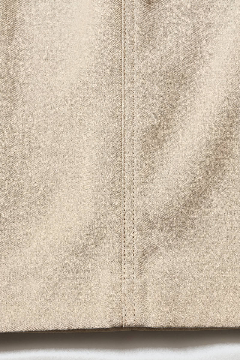 Alve byxor i sand — tygdetalj