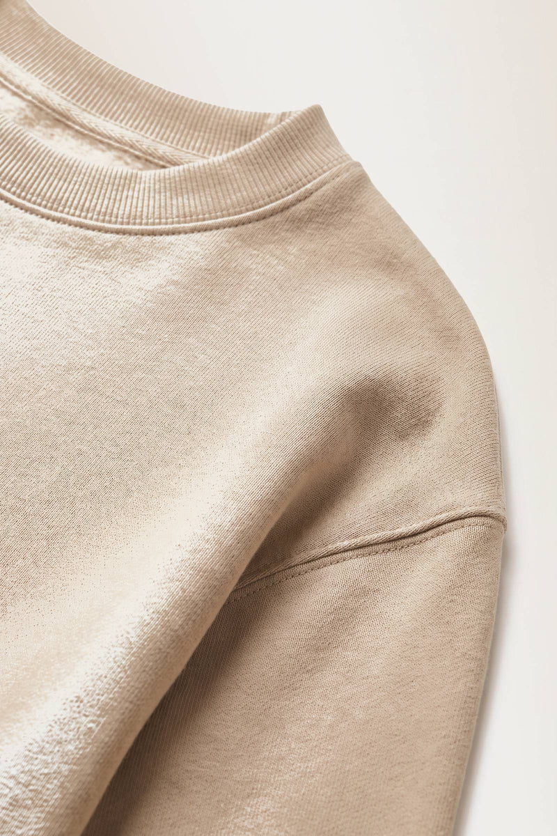 Vik sweatshirt i sand — tygdetalj